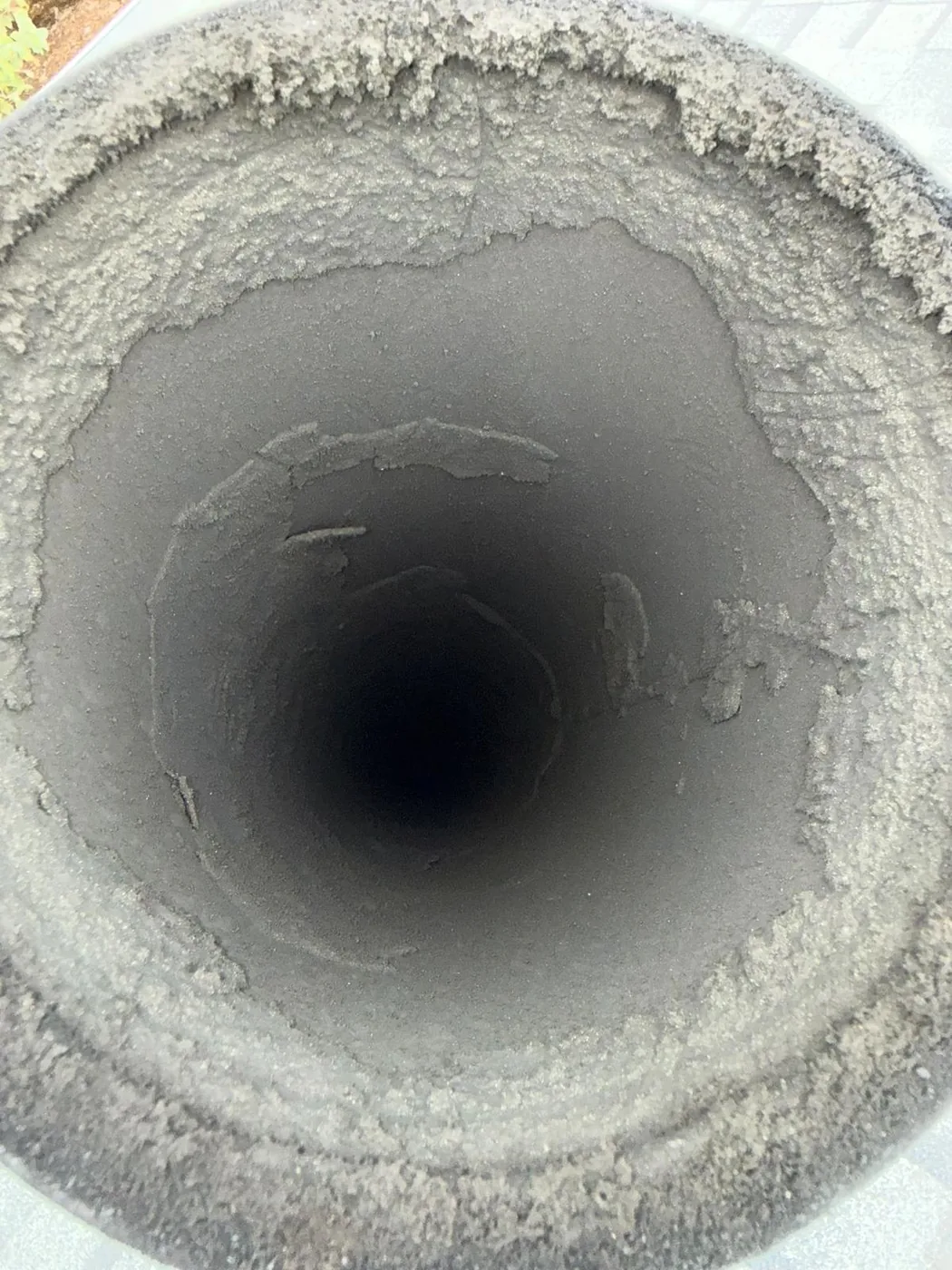 Heavy Soot Buildup Removed — Same Metal Flue before