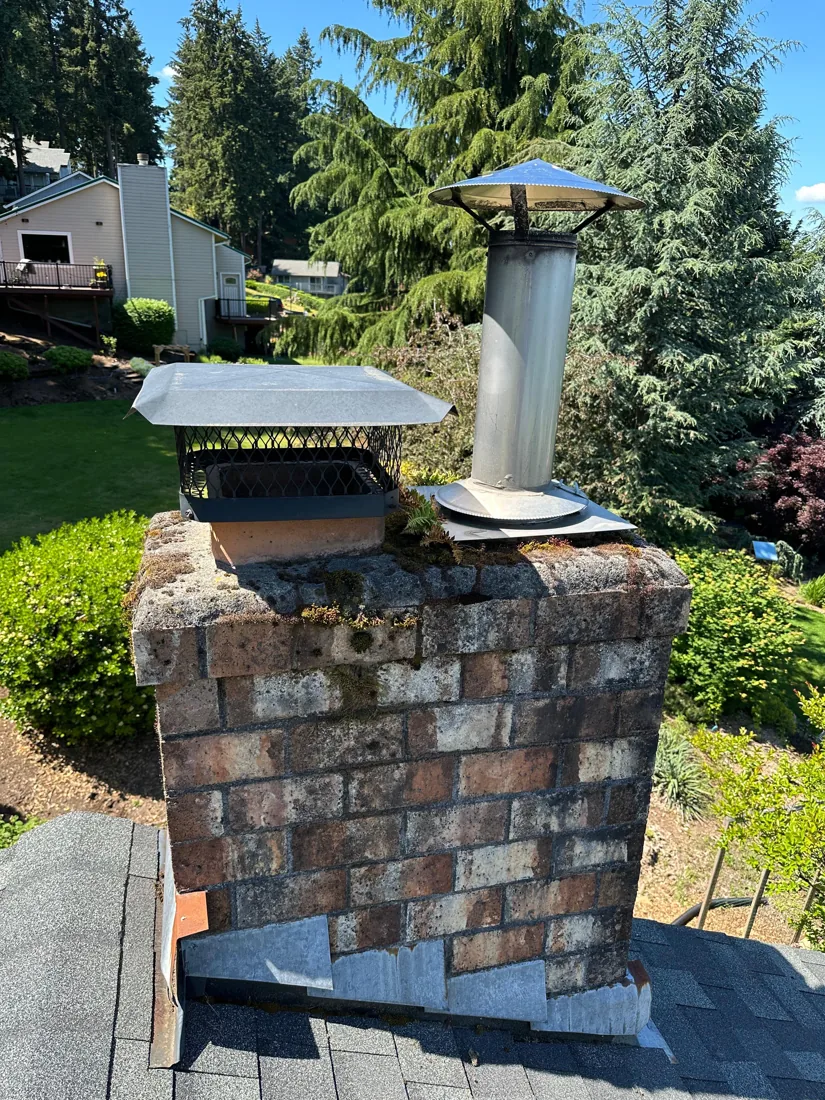 Failing Brick & Caps → Cleaned Masonry, New Crown & Base Flashing before